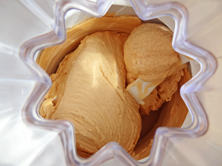 Churning apricot honey ice cream in the ice cream maker