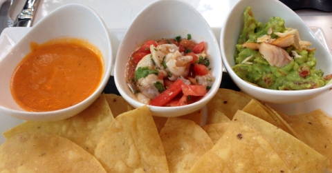 Botanitas: House red sauce, halibut traditional ceviche, and smoked trout guacamole, served with chips