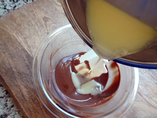 Streaming hot cream into melted chocolate